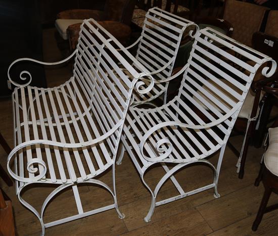 A garden bench and two armchairs
